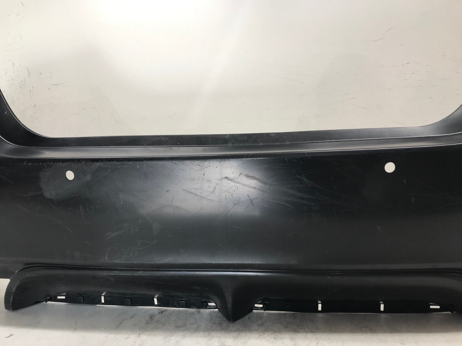 Rear Bumper Cover Unpainted 18-21 Toyota Camry SE/XSE/Hybrid w/Sensor Holes OEM